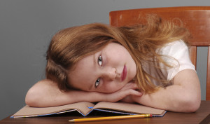 iStock 000006002687 Medium 300x177 - Girl Laying Down Head on Desk